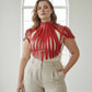 Plus Size Bold Leather Strap Body Harness by HarnessClub in red, strappy high-neck design on model