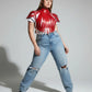 Plus Size Bold Leather Strap Body Harness by HarnessClub, red leather, strappy design worn on model.
