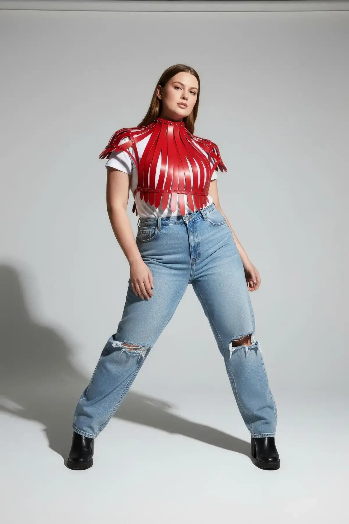 Plus Size Bold Leather Strap Body Harness by HarnessClub, red leather, strappy design worn on model.