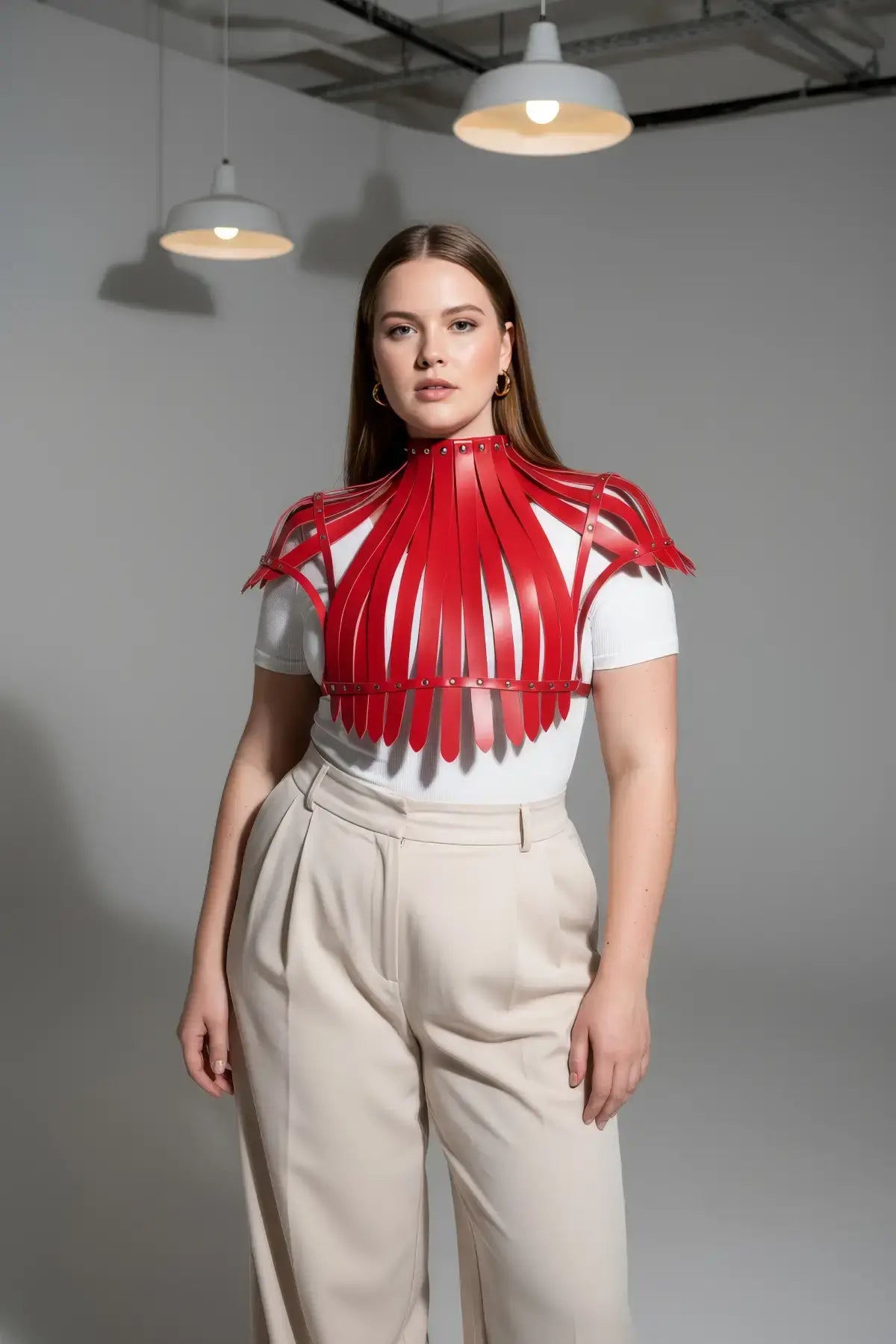 Plus Size Bold Leather Strap Body Harness in red, strappy design shown on model