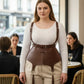 Plus Size Brown Corset Suspender Harness with Tassels in cognac vegan leather worn over white top.