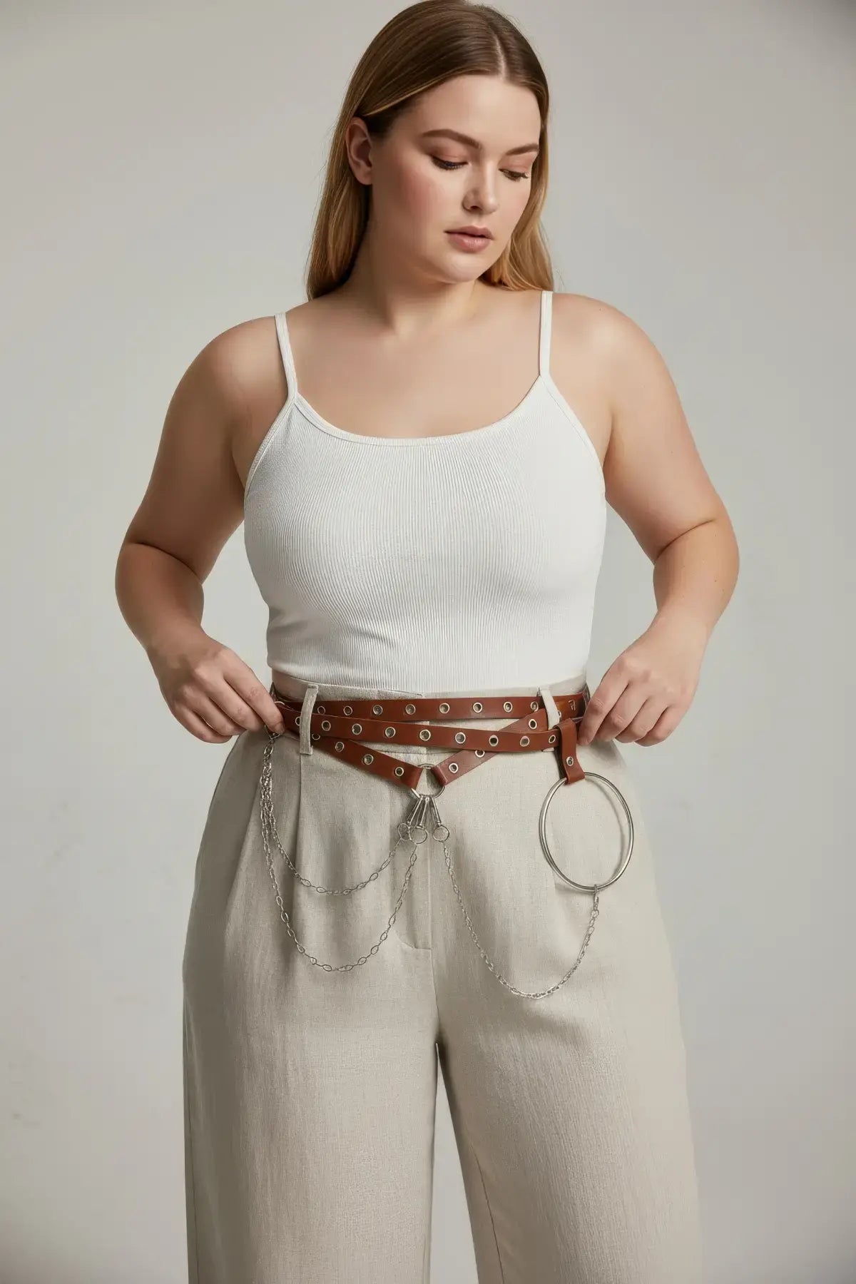 Plus-size brown grommet belt with o-ring chain cluster in cognac vegan leather by HarnessClub