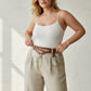 Plus-size brown grommet belt with o-ring chain cluster worn at waist in cognac vegan leather by HarnessClub