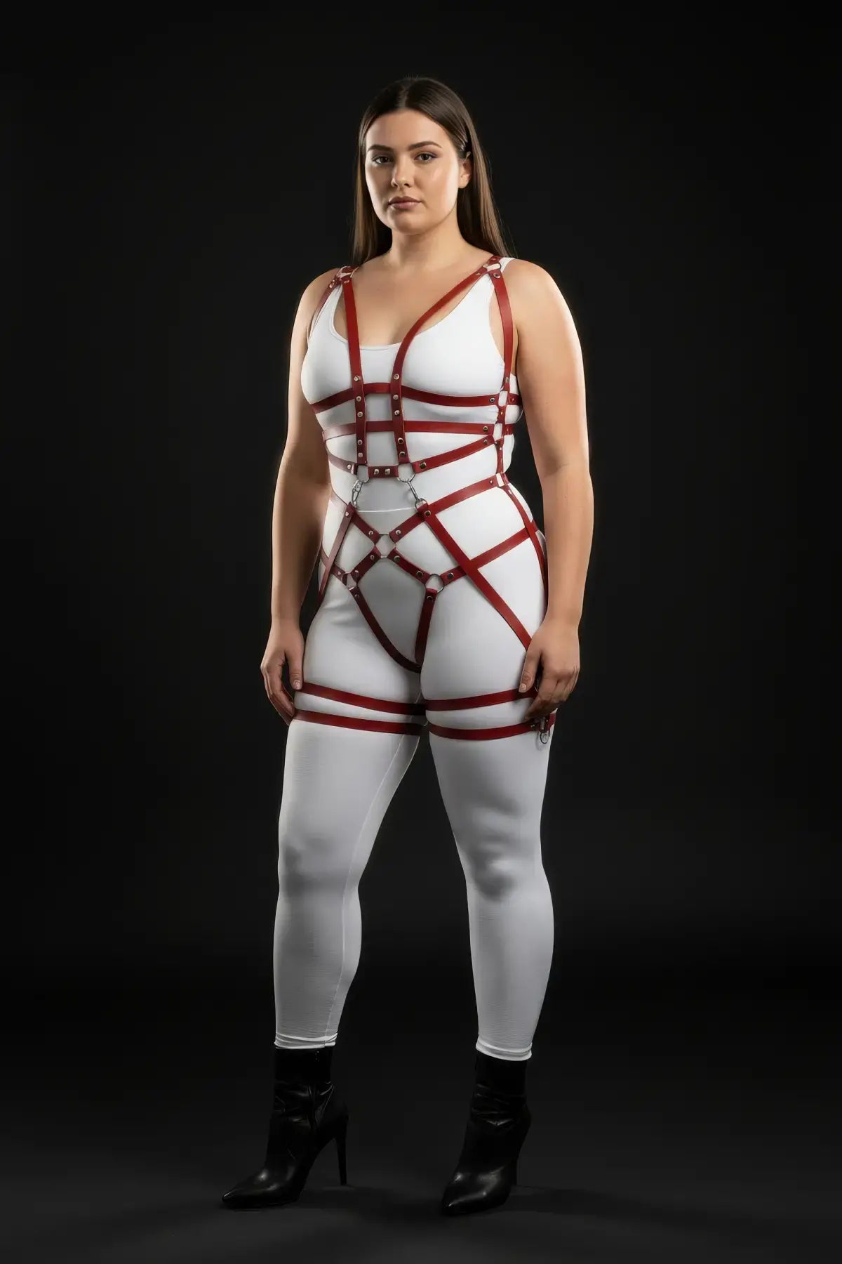 Plus-size burgundy vegan-leather grid-band full-body harness set worn over white bodysuit; silver hardware