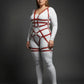 Plus-size burgundy grid-band full-body harness set worn over a white bodysuit; vegan leather straps