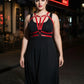 Plus Size Burgundy vegan leather V-Strap chest harness worn over a black dress