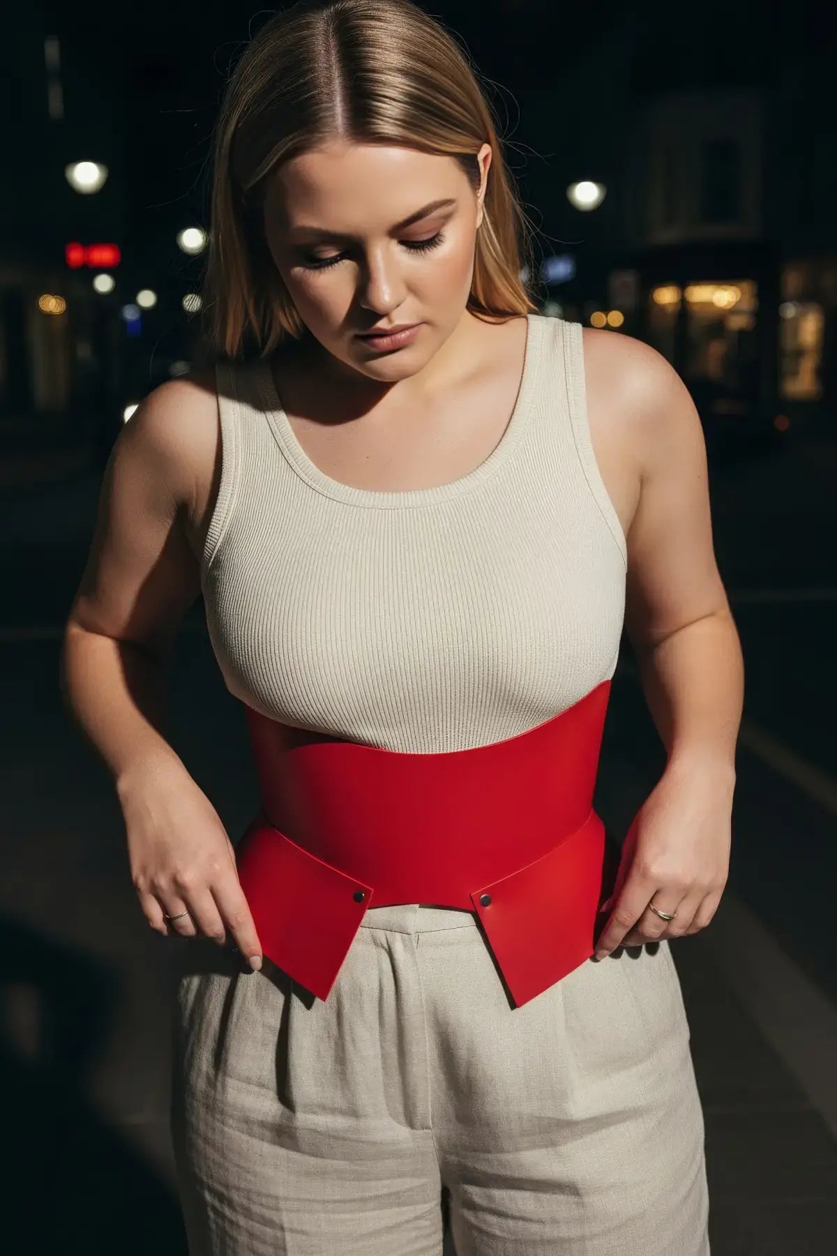 Plus Size Burgundy Wide Corset Belt by HarnessClub in vegan leather, worn over a cream sleeveless top.