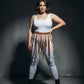 Plus-size cognac vegan leather eyelet belt with strap-fringe harness skirt worn by model