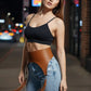 Plus Size Cognac Tassel High-Waist Hip Belt; vegan leather harness with tassels worn over jeans.
