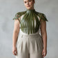 Plus Size Corset-Look Leather Body Harness in olive green by HarnessClub, worn over white top.