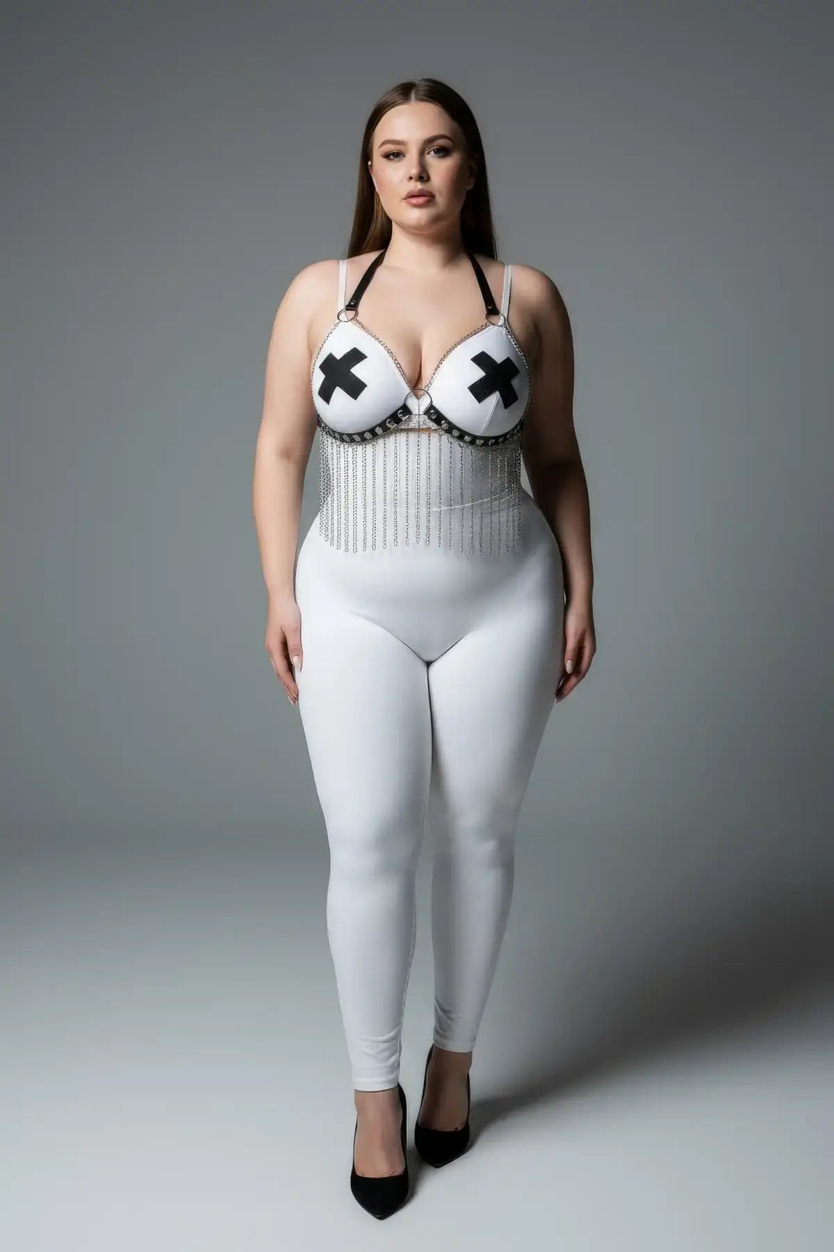 Plus-size cream chain-detail faux leather harness over white bodysuit with black X pasties and fringe chains
