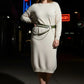 Plus-size khaki vegan-leather double-layer waist belt with two straps and chain drapes, worn over a cream knit dress.