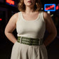 Plus-size khaki vegan-leather wide belt with two-row grommets worn with a cream dress HarnessClub