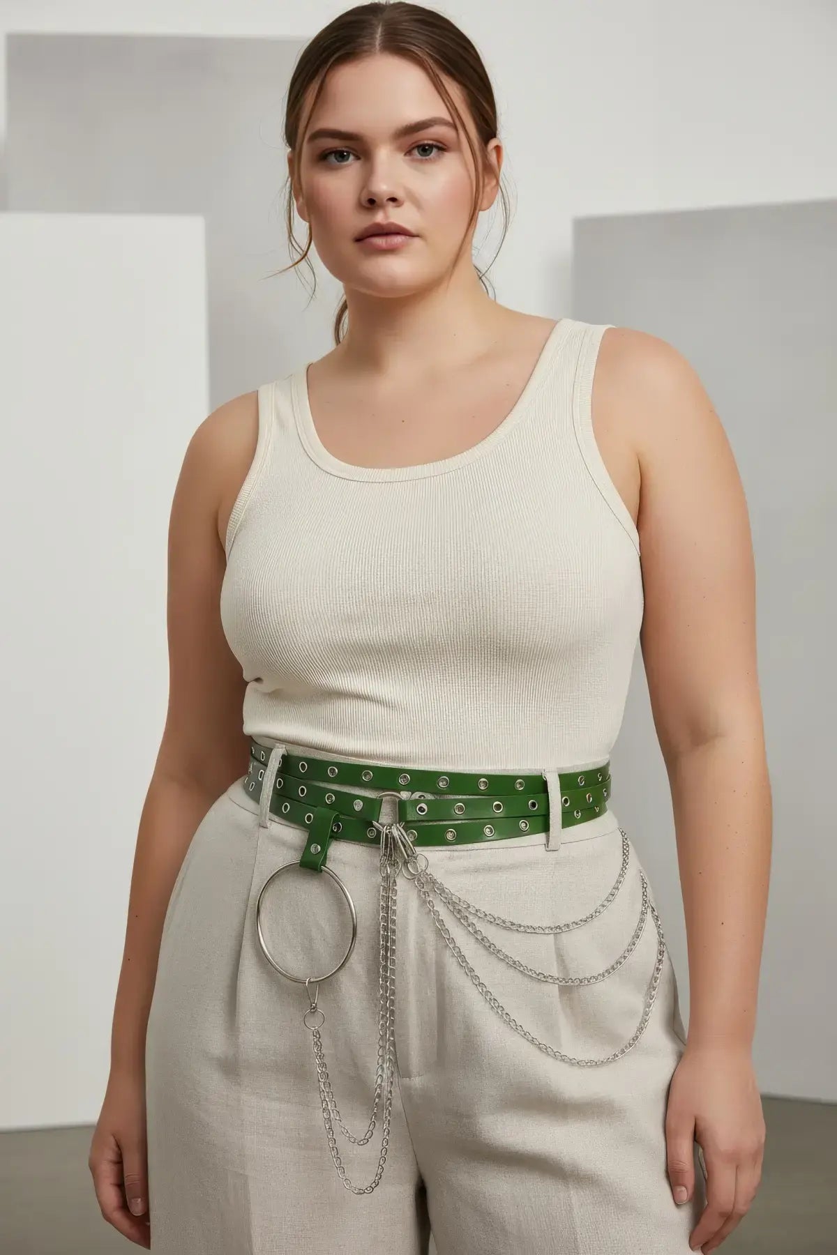 Plus-size green vegan leather grommet belt with O-ring and chain detail by HarnessClub