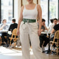 Plus-size khaki vegan-leather belt with grommets, O-ring and chain detail.