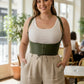 Plus Size Khaki Lace-Up Corset Belt by HarnessClub, worn over a white ribbed tank.