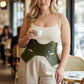 Plus-size khaki vegan-leather lace-up corset belt worn at the waist