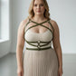 Plus-size khaki leather body harness over beige tank top with waist belt, HarnessClub