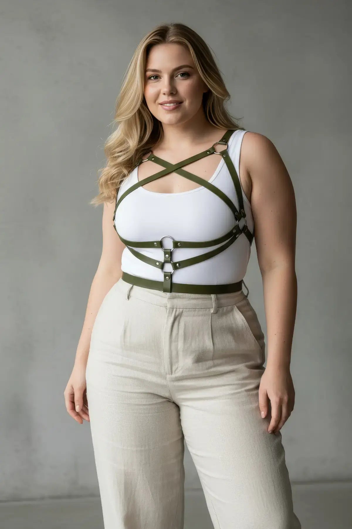 HarnessClub plus-size khaki leather body harness worn over a white tank top