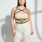 Plus-size khaki leather body harness worn over beige top