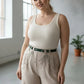 Plus-size green vegan leather belt with cascading silver chain drapes.