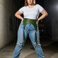 Plus size khaki vegan leather corset waist belt with tassels worn over jeans