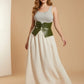 Plus-size khaki vegan leather corset belt by HarnessClub, worn over a cream dress.