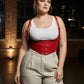 Plus-size lace-up vegan-leather corset harness in red by HarnessClub worn over a white top.