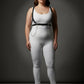 Plus Size Minimalist Shoulder Strap Harness with Chain Tails, black vegan leather with silver chains over white bodysuit