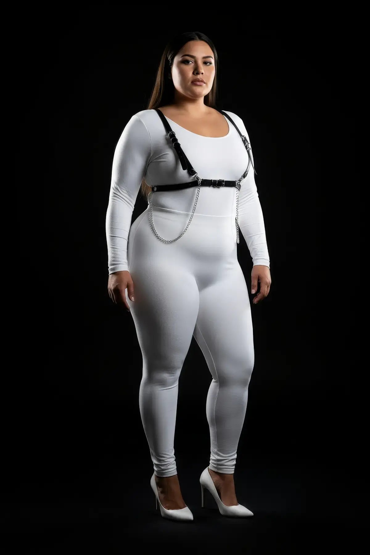 Plus-size minimalist shoulder strap harness with chain tails, black vegan leather and silver chains over white bodysuit