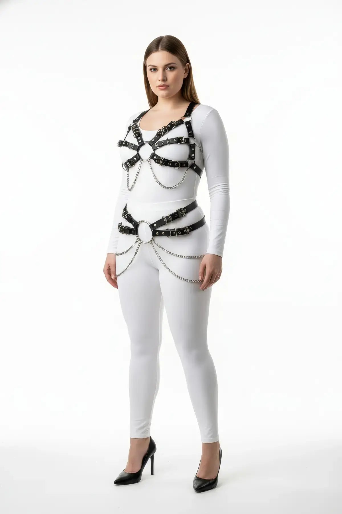 Plus-size multi-buckle chest harness with chain-drape waist belt; black vegan-leather two-piece body accessory.