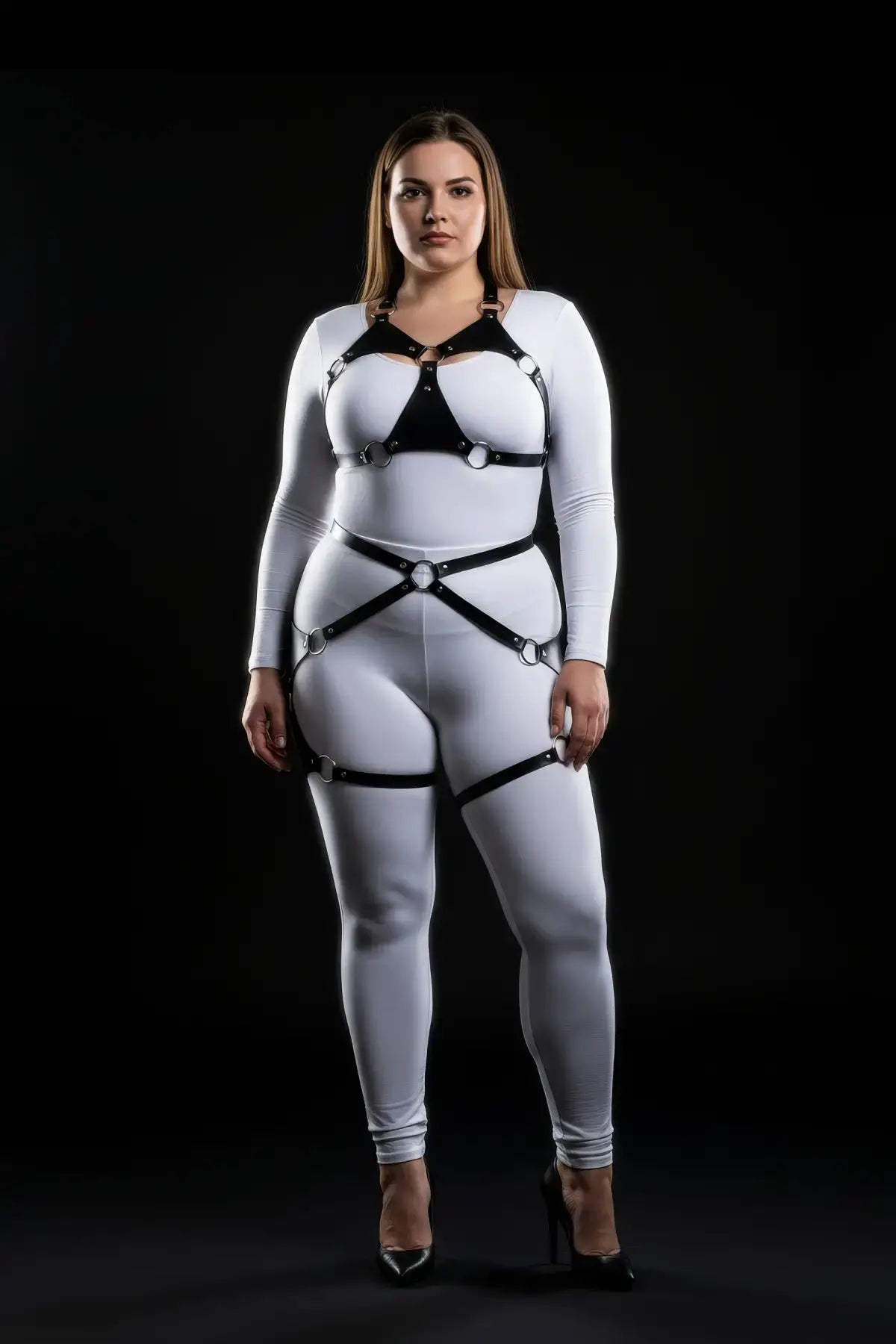 Plus-size O-ring bralette harness two-piece vegan leather set on white bodysuit with black crossover straps