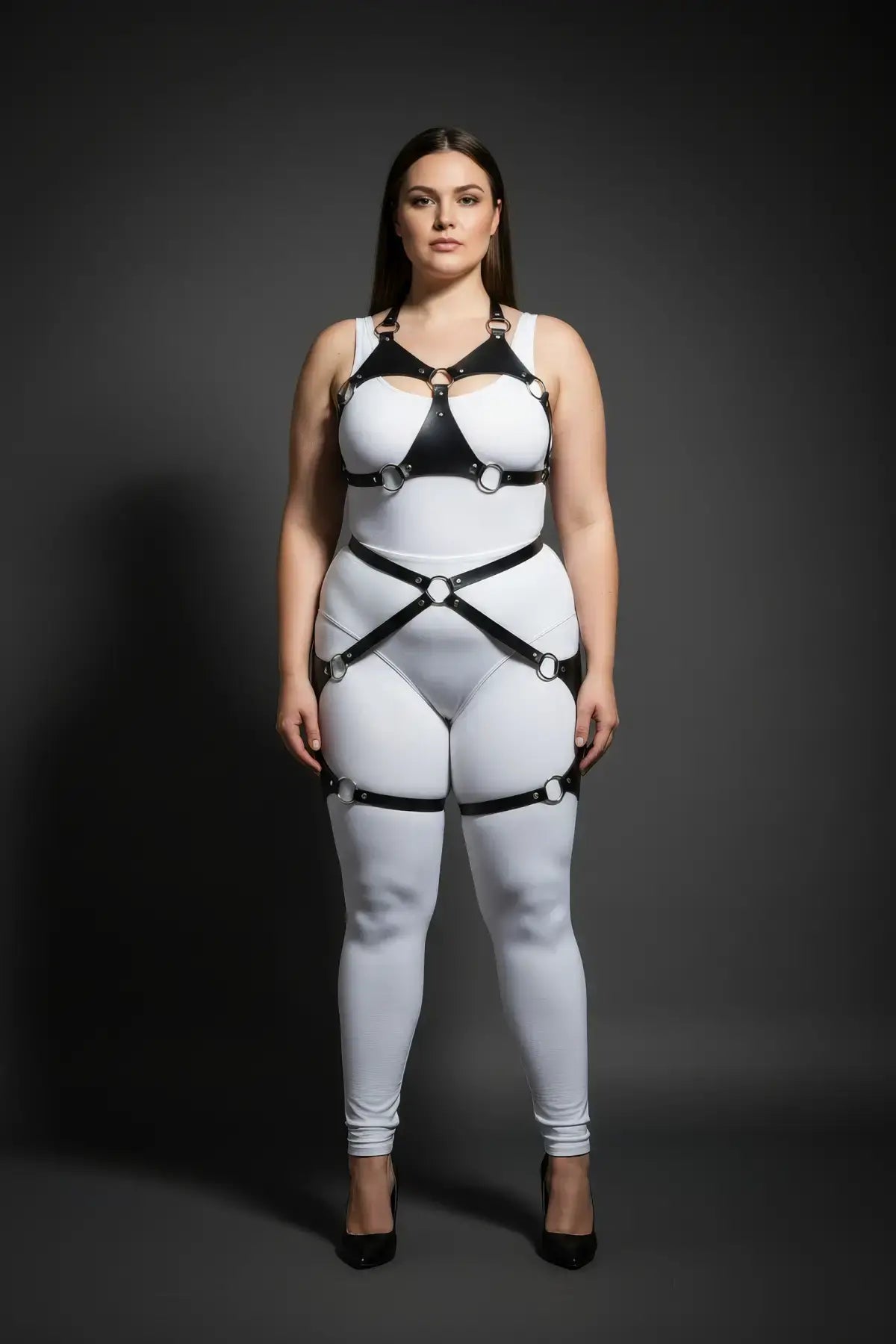 Plus Size O-Ring Bralette Harness with Crossover Hip Garter by HarnessClub, black vegan leather straps on white bodysuit