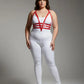 Plus-size red adjustable faux-leather body harness set with multiple straps around the torso worn over a white top