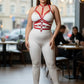 Plus Size red adjustable full-body faux leather harness by HarnessClub worn over white bodysuit