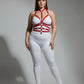 Plus-size red adjustable full-body faux leather harness on white bodysuit.