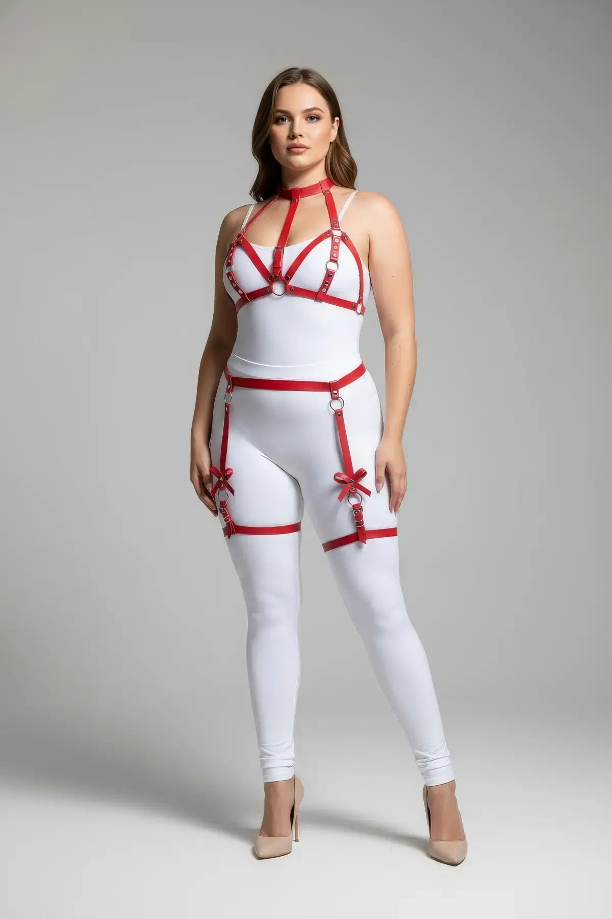 Plus-size red bow-detail faux leather garter harness over white bodysuit, HarnessClub