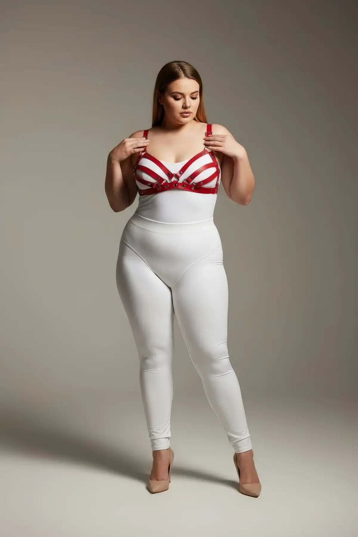 Plus Size Red Bra-Style Faux Leather Harness Set displayed over a white bodysuit with metal hardware