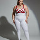 Plus-size red faux-leather bra-style harness set by HarnessClub worn over a white top