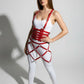 Red buckled suspender corset with diamond cage skirt body harness in vegan leather by HarnessClub