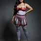 Plus-size two-piece red cage bralette and skirt harness set in vegan leather