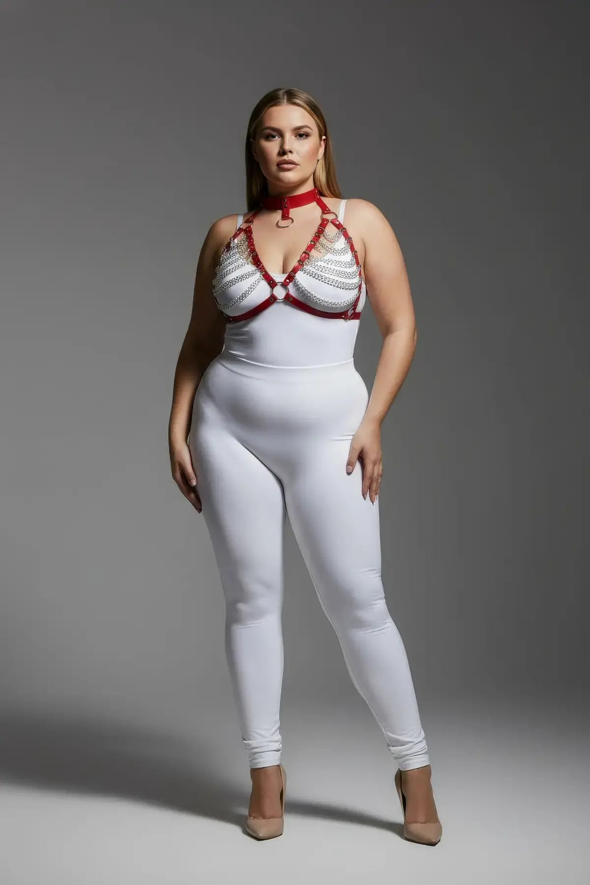 Plus-size red chain harness with choker collar and faux leather straps over white bodysuit.