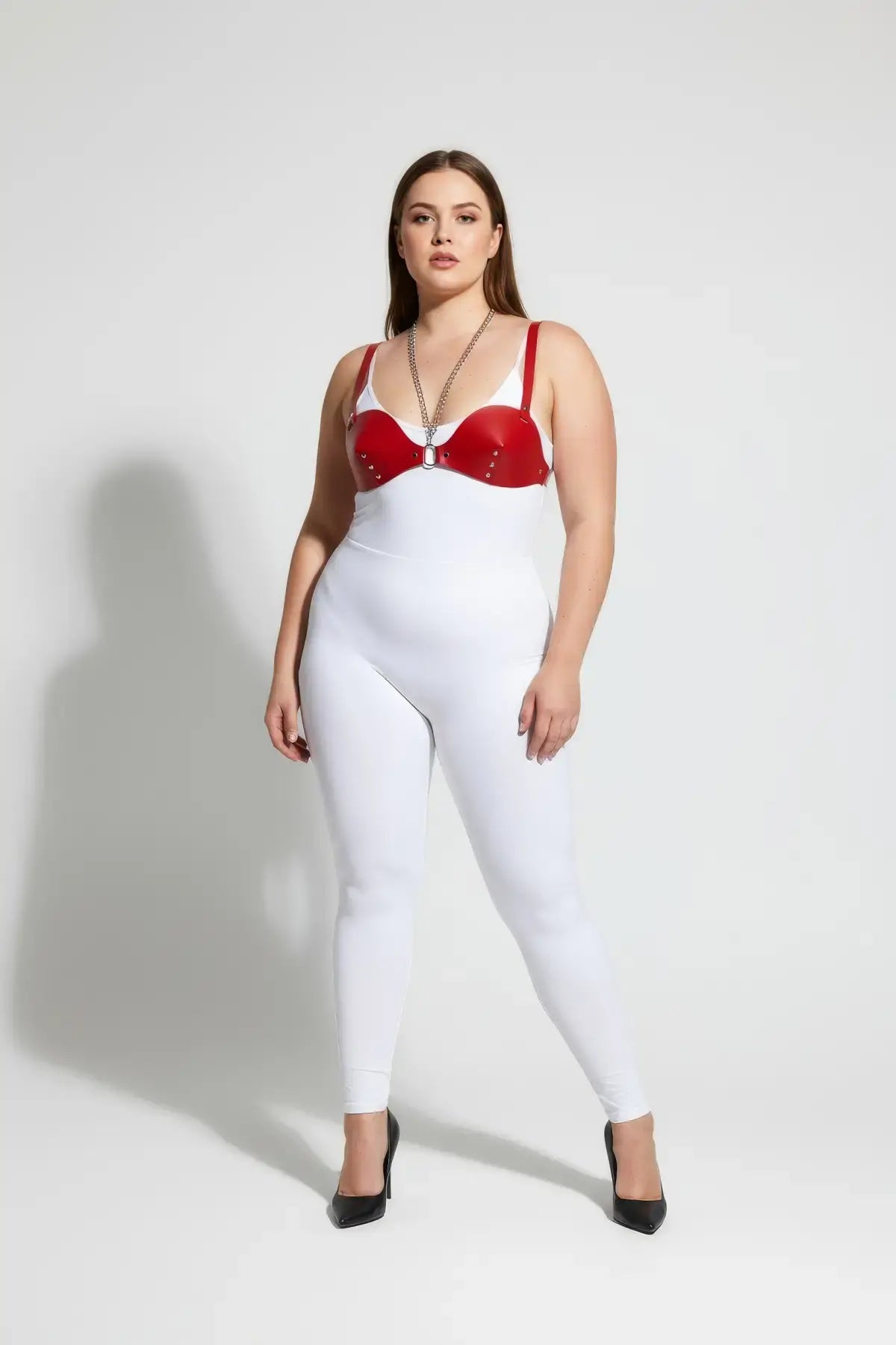 Plus Size Red Chain and Stud Faux Leather Chest Harness by HarnessClub worn over a white bodysuit