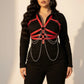 Plus-size red chain-detail body harness worn over black top; vegan leather with silver chains by HarnessClub.