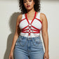 Plus size red vegan leather chain-detail body harness with silver hardware worn over a white tank top.