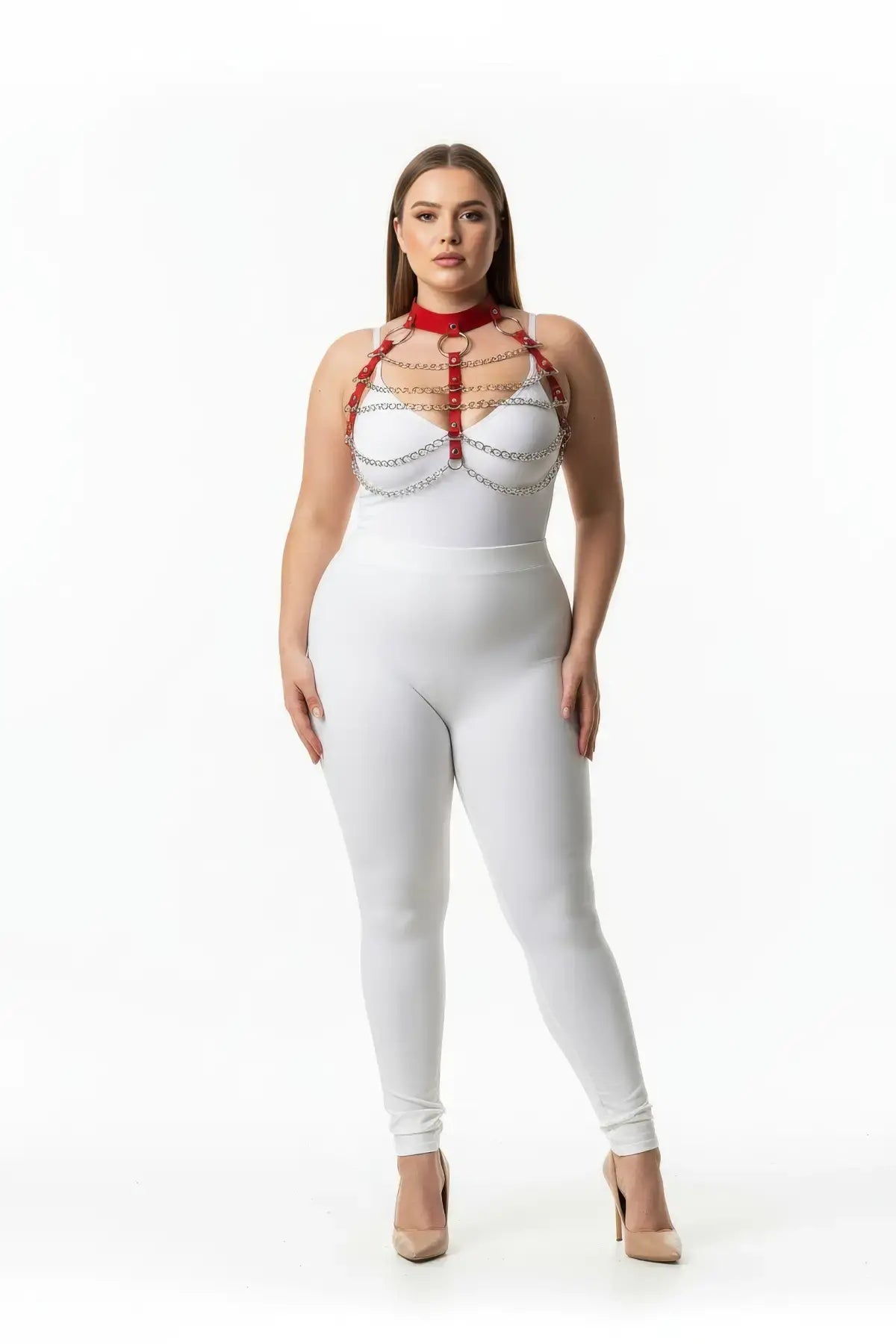 Plus-size red chain-detail faux leather chest harness by HarnessClub worn over a white bodysuit.