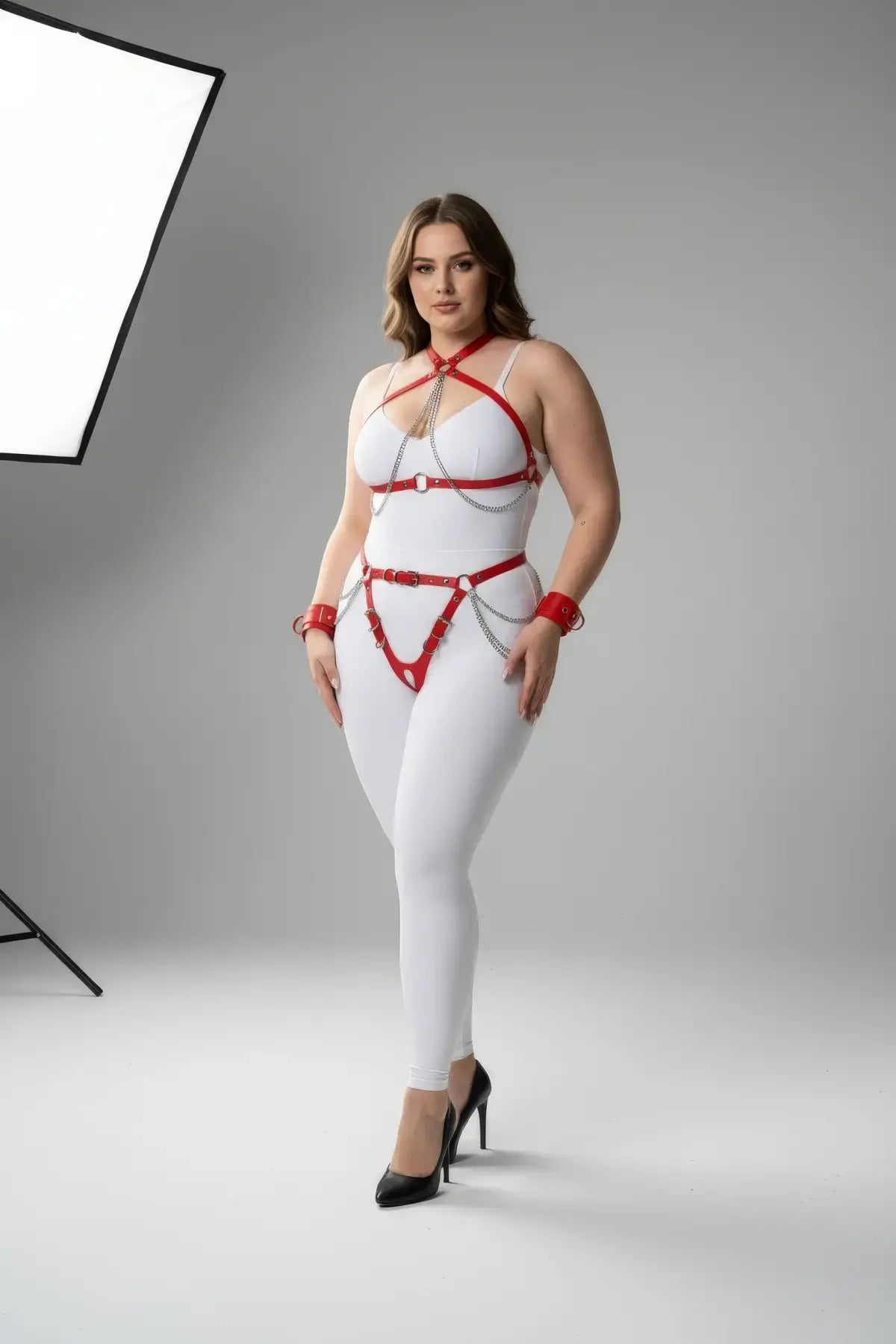 Plus-size red faux-leather body harness set with silver chain accents