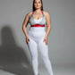 Plus Size red chain-detail faux leather harness set on model with white bodysuit and red belt