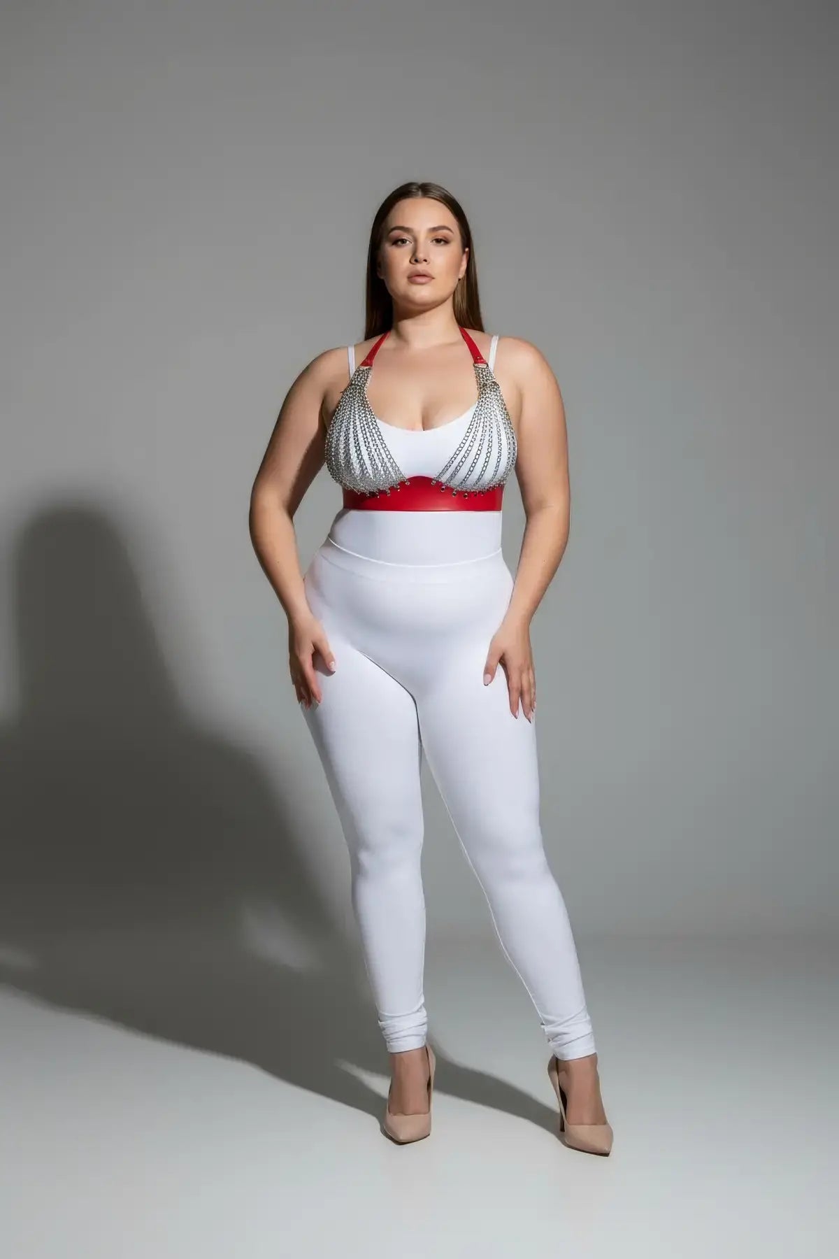 Plus Size red chain-detail faux leather harness set on model with white bodysuit and red belt