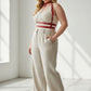 Plus Size Red Chain-Detail Leather Body Harness by HarnessClub worn over a white top